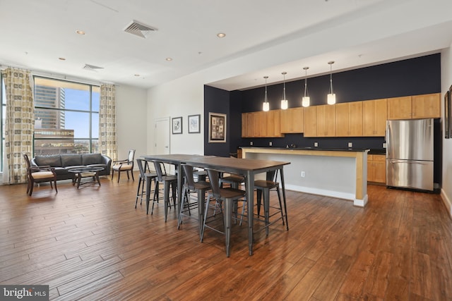 dining area featuring dark hardwood / wood-style floors