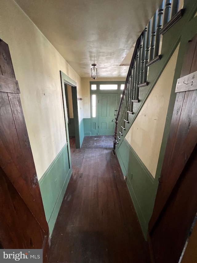 corridor featuring dark hardwood / wood-style floors