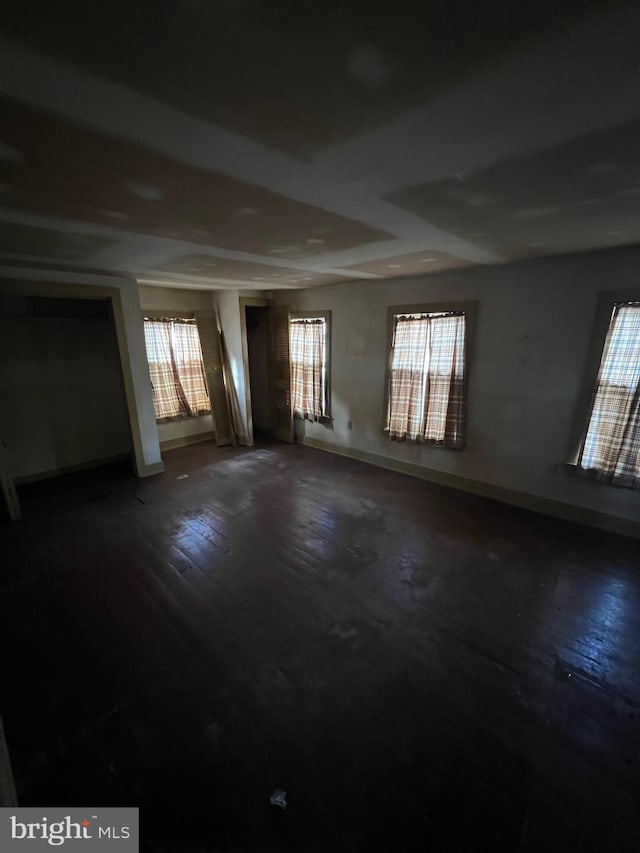 interior space featuring hardwood / wood-style floors and plenty of natural light