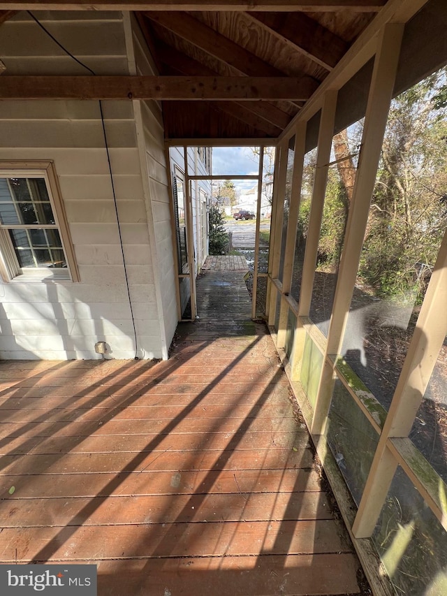 exterior space featuring vaulted ceiling