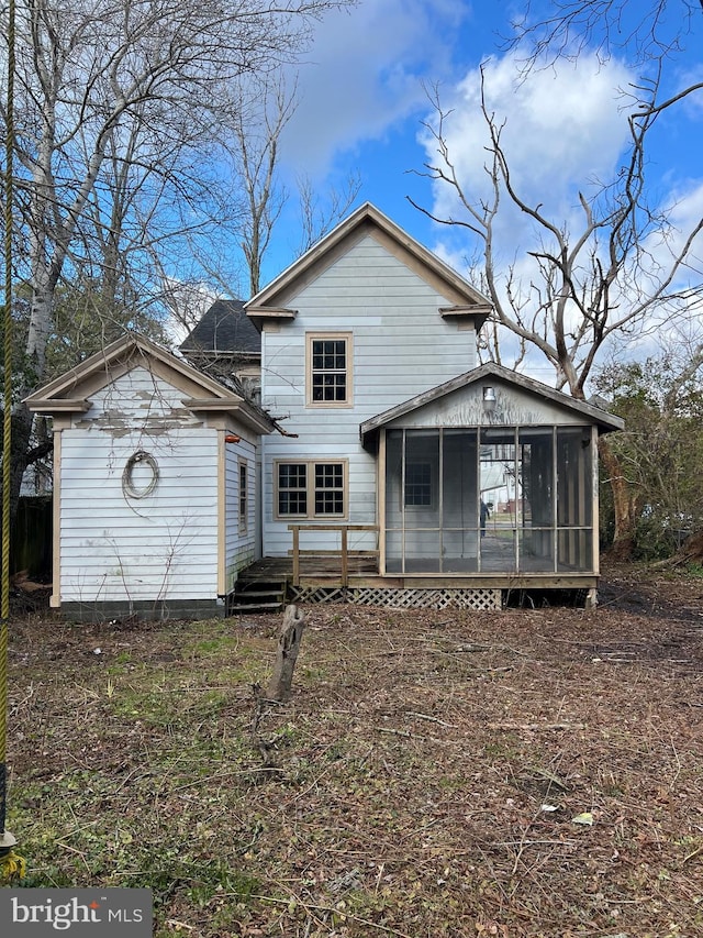 back of property featuring a sunroom