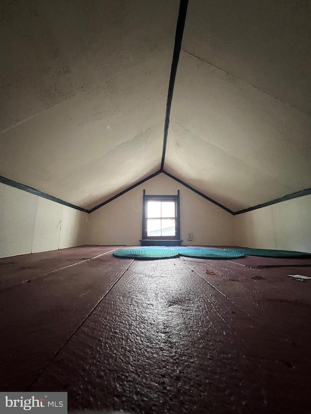 bonus room featuring vaulted ceiling