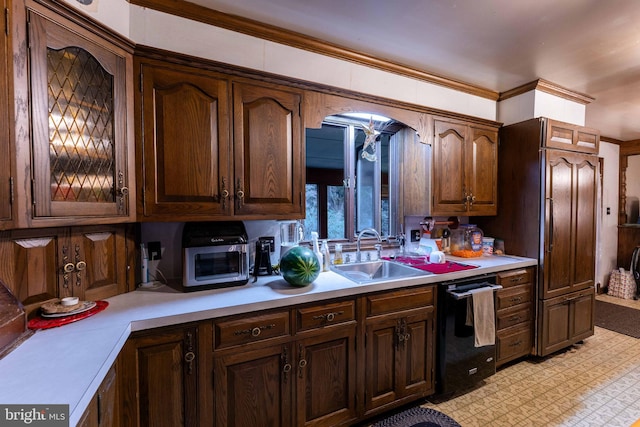 kitchen featuring high end fridge, dishwasher, dark brown cabinetry, and sink