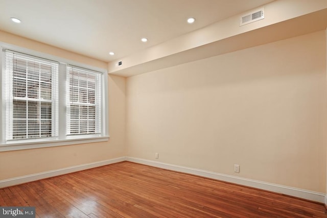 empty room featuring hardwood / wood-style floors