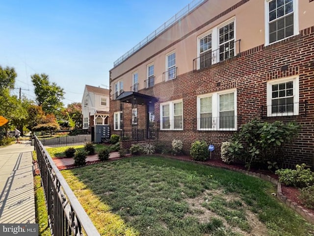 exterior space featuring a front lawn