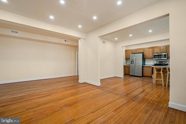 unfurnished living room featuring light wood-type flooring