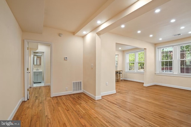 spare room featuring light hardwood / wood-style flooring and sink