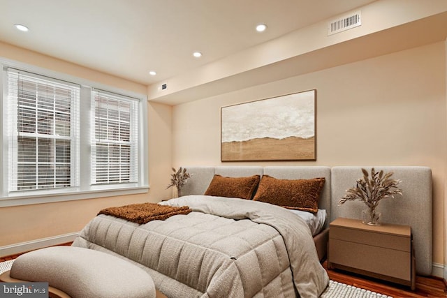 bedroom with hardwood / wood-style floors