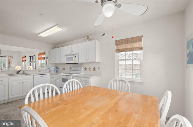 dining area featuring sink and ceiling fan