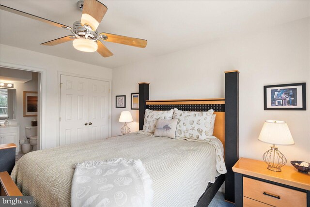 bedroom featuring ceiling fan, a closet, and ensuite bathroom