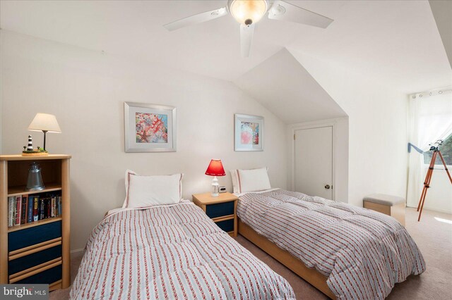 bedroom featuring carpet flooring, ceiling fan, and vaulted ceiling