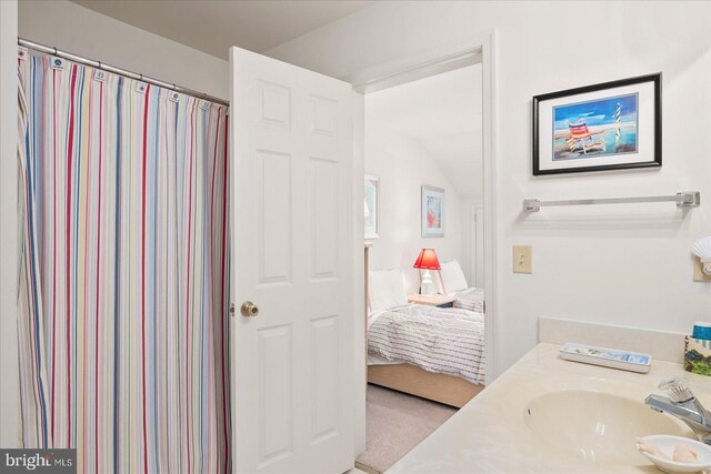 bathroom with vanity and a shower with shower curtain