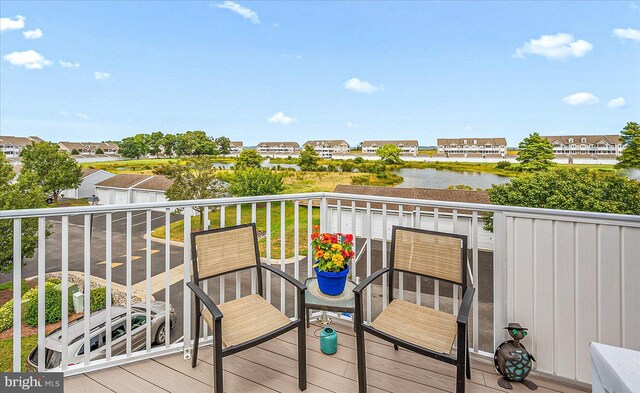 balcony featuring a water view