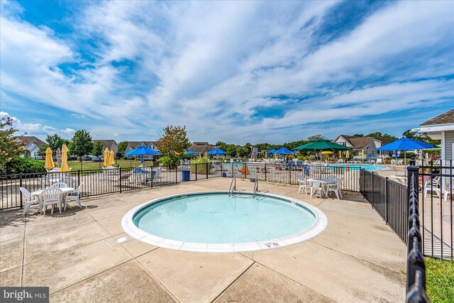 view of swimming pool featuring a patio