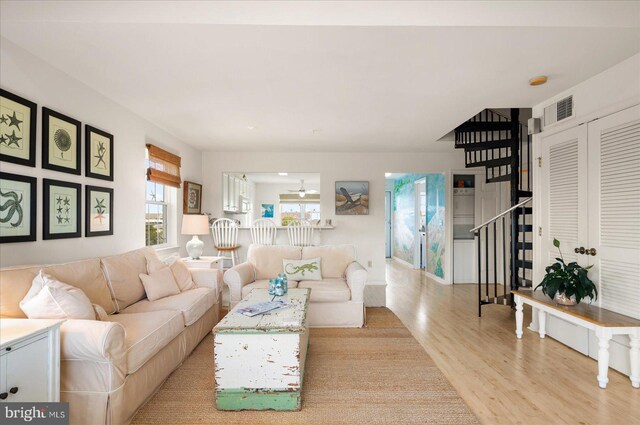 living room with light hardwood / wood-style floors