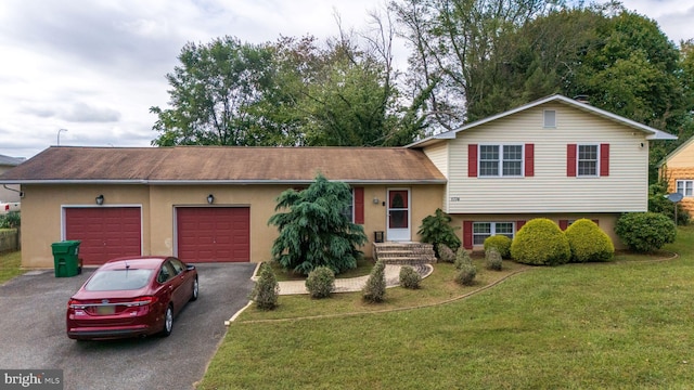 split level home with a garage and a front yard