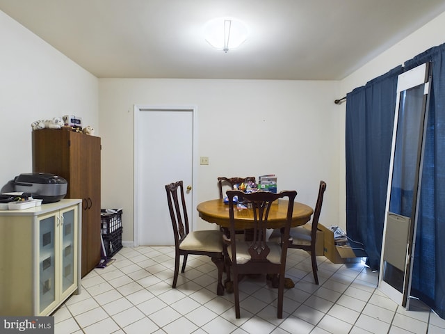 dining area with light tile patterned flooring