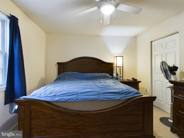 carpeted bedroom with ceiling fan