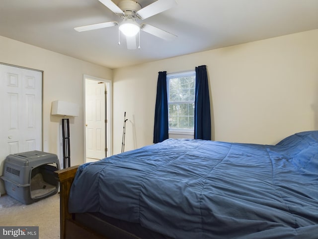 carpeted bedroom featuring a closet and ceiling fan