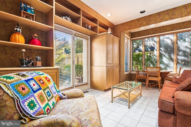 living room with light tile patterned floors and a healthy amount of sunlight
