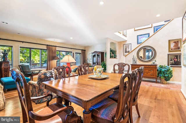 dining space featuring light wood-type flooring, recessed lighting, and baseboards