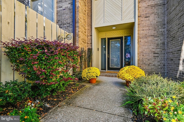 property entrance with brick siding