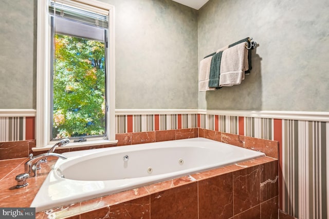 full bath with a whirlpool tub