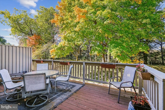 wooden terrace featuring outdoor dining space