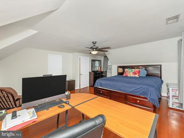 bedroom with wood-type flooring, vaulted ceiling, and ceiling fan