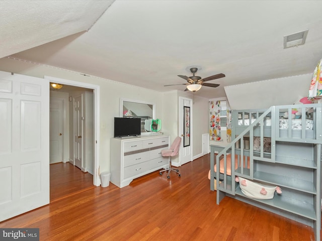 bedroom featuring ceiling fan and hardwood / wood-style flooring