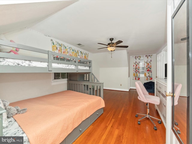 bedroom with ceiling fan and hardwood / wood-style floors