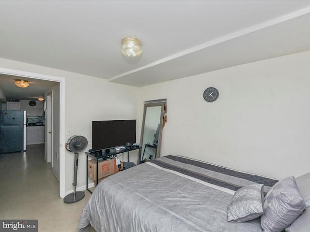 bedroom featuring fridge