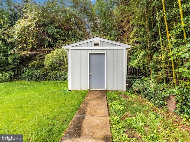 view of outdoor structure with a lawn