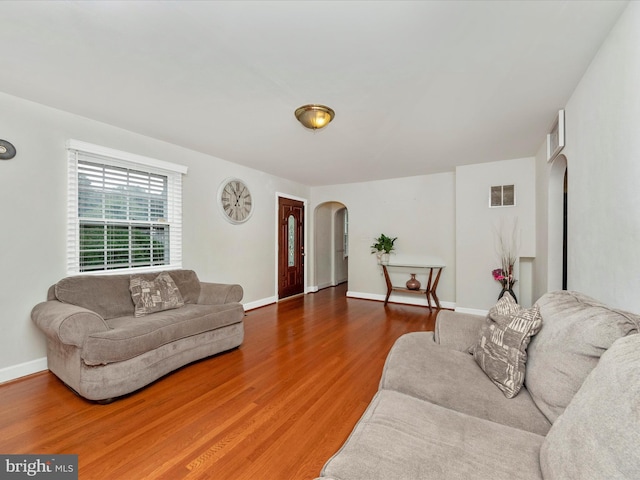 living room with dark hardwood / wood-style floors