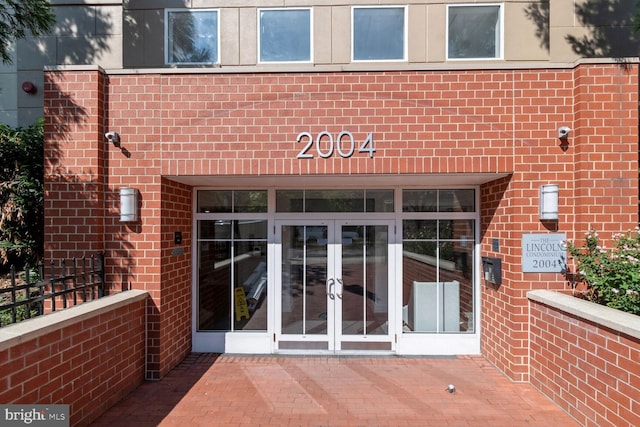 property entrance featuring french doors