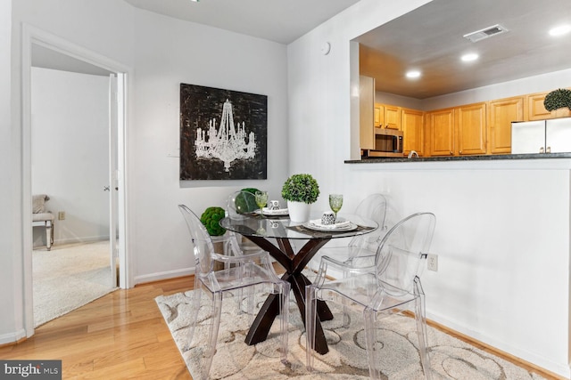 dining area featuring light hardwood / wood-style floors