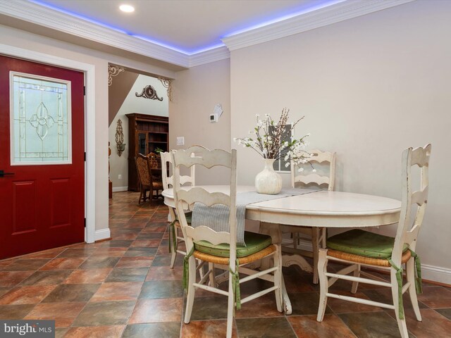 dining space featuring ornamental molding