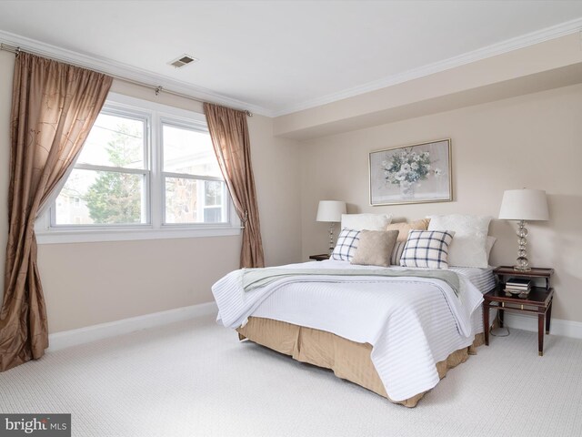 carpeted bedroom featuring ornamental molding