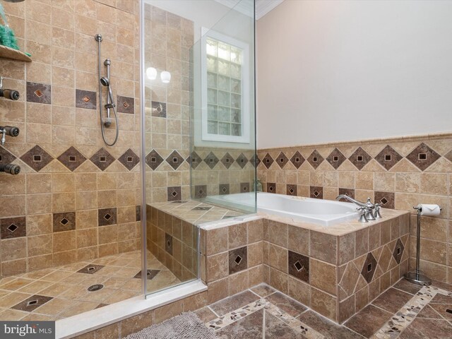 bathroom featuring tile walls, independent shower and bath, and tile patterned flooring