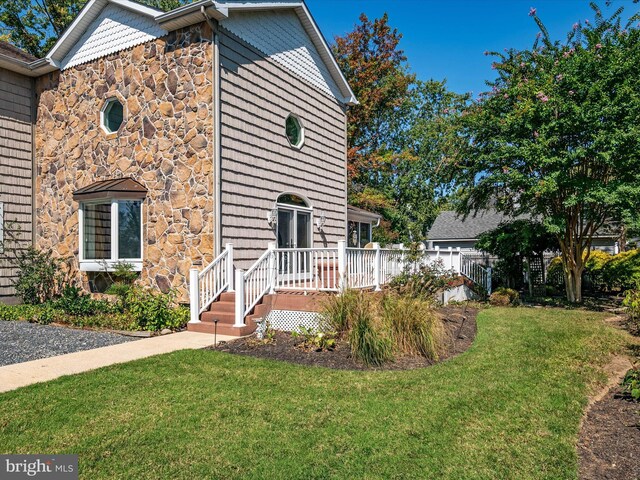 view of front of home with a front yard