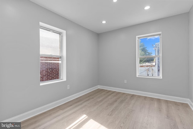 empty room with light hardwood / wood-style floors