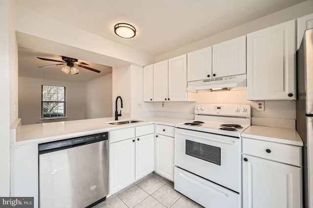 kitchen featuring white cabinets, kitchen peninsula, sink, and appliances with stainless steel finishes