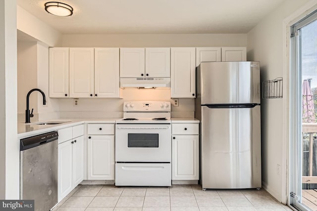 kitchen featuring white cabinets, light tile patterned flooring, sink, and stainless steel appliances