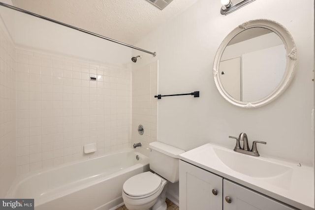 full bathroom with tiled shower / bath combo, toilet, and vanity