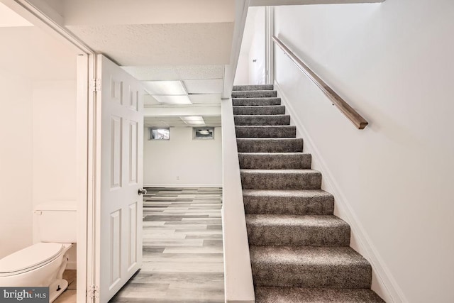 staircase featuring hardwood / wood-style flooring