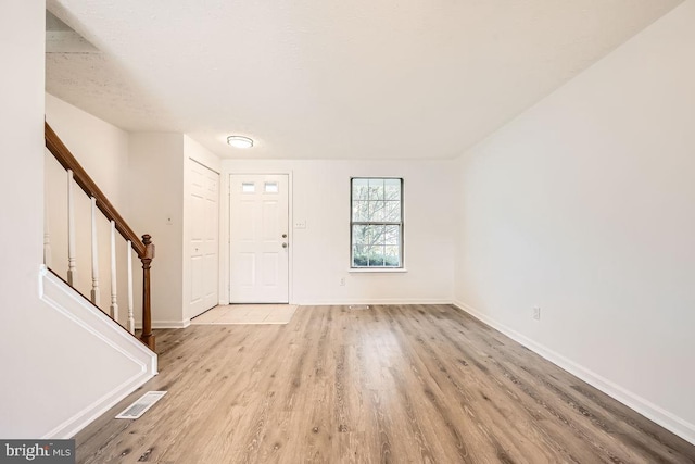 entrance foyer with light wood-type flooring