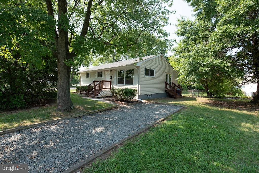 ranch-style house with a front lawn