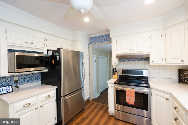 kitchen featuring crown molding, stainless steel appliances, ceiling fan, dark wood-type flooring, and white cabinets