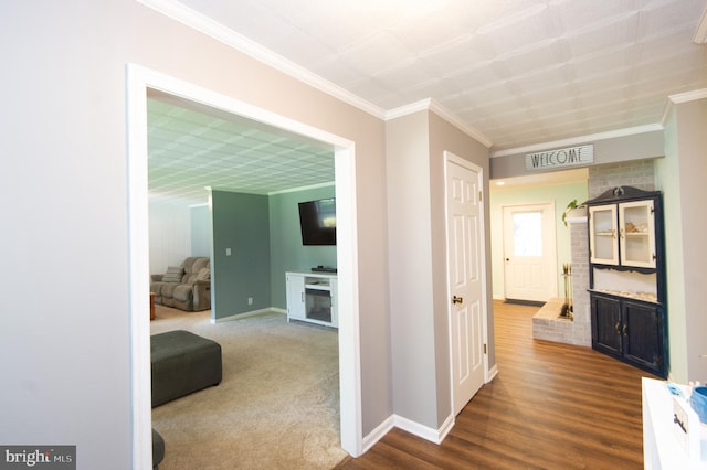 corridor featuring wood-type flooring and crown molding