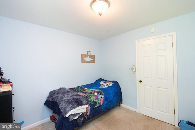 bedroom featuring light colored carpet